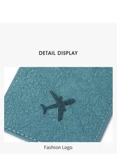 Close-up of cyan PU leather luggage tag featuring litchi texture and aircraft logo