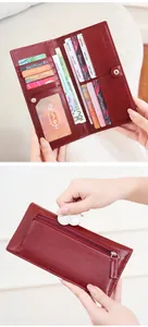Detail view of burgundy leather long wallet showing multi-card slots and zippered coin pocket