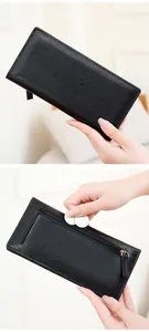 Close-up of the back zipper pocket on the black long wallet for secure coin storage