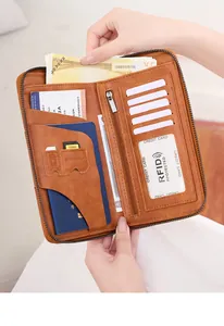 Detail view of brown RFID travel wallet with multiple slots for passport and credit cards