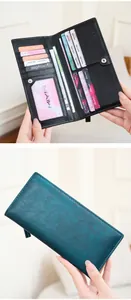 Detailed view of women's long wallet featuring 11 card slots and double snap zipper closure