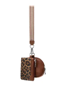 Detail of leopard print card holder and brown zipper pouch with woven wristlet strap