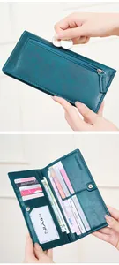 Macro detail of teal RFID long wallet with multiple card slots and secure zipper pocket