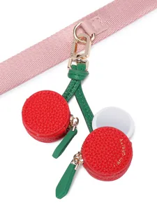 Detail of cherry-shaped coin purse with lychee texture and hidden mirror feature