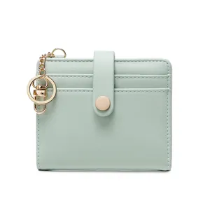 Slim RFID-blocking bifold wallet for women in mint green leather with metal hook clasp