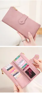 Detail of pink long wallet with multiple card slots and secure RFID blocking technology