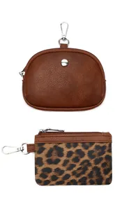 Detail view of two mini coin purses with leopard print and vintage brown faux leather