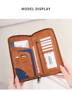 Detail of brown RFID leather travel wallet with passport slot and SD card holders