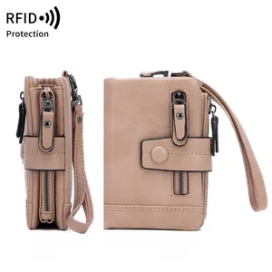 Pink RFID blocking PU leather wallet with wristlet strap and zipper closure