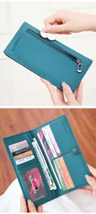 Detailed interior of long teal RFID wallet showing card slots and smooth coin zip pocket