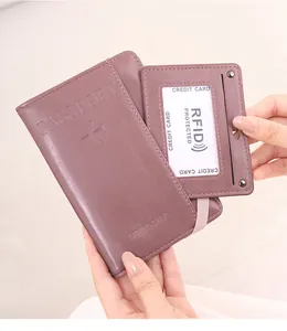 Detailed close-up of purple RFID passport holder with elastic band and card slot