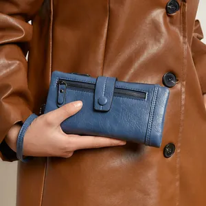 Navy blue RFID leather wallet for women with zipper pocket and wristlet strap