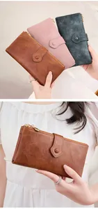 Detail of multi-color long wallets featuring double zippers and textured vegan leather