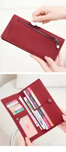 Detail of red RFID leather wallet showing interior card slots and zipper pocket