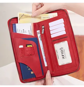 Detail of red leather RFID passport wallet showing large capacity for cards and cash