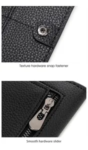 Detail of black lychee leather texture with silver snap fastener and smooth metal zipper slider