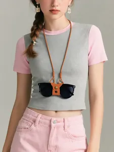 Brown PU leather glasses holder necklace with metal clasp shown on a model wearing pink