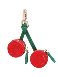 Close-up of cherry coin purse pendant with gold zipper and I am cherry gold foil text