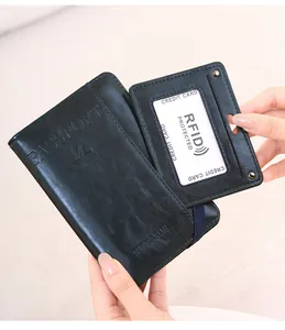 Close-up of a blue leather passport holder and RFID card sleeve with elastic strap