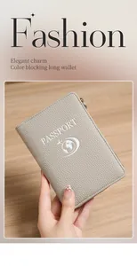 Close-up of grey litchi texture RFID passport holder with zipper and embossed aircraft logo