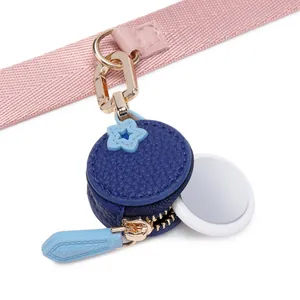 Mini leather AirTag pouch with cherry blue star design and gold keychain clip