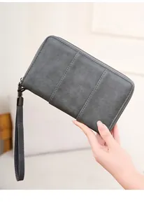 Detail of dark grey RFID passport wallet with triple vertical stitching and wrist strap