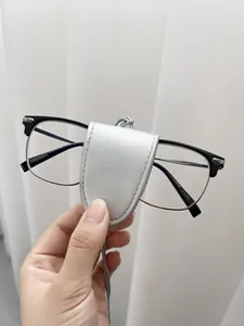 Detailed close-up of a silver PU leather eyeglass holder with refined texture and neck cord