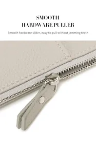 Detail of smooth silver hardware zipper puller on litchi texture RFID passport holder