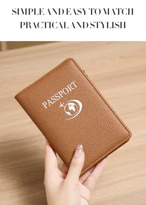 Close-up of brown litchi pattern leather passport holder with metal zipper and logo