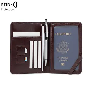 Deep brown RFID blocking leather passport holder with card slots and pen loop