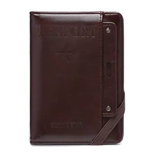 Dark brown leather RFID passport holder with secure elastic strap and embossed design