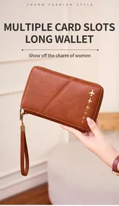 Brown textured leather RFID passport wallet with gold airplane motifs and hand strap