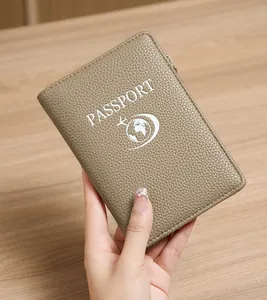 Close-up of a light brown litchi pattern leather passport holder with RFID protection