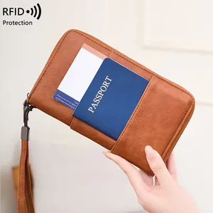 Brown leather RFID passport wallet with large capacity and zipper closure for travel