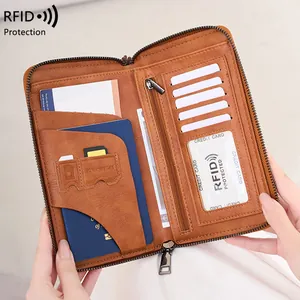 Brown leather RFID travel wallet showing multi-slot interior for passport and cards