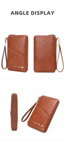 Brown leather passport wallet with gold airplane studs and zipper closure details