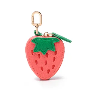 Portamonete a forma di fragola in pelle rosa con foglie verdi e clip dorata
