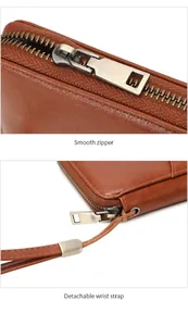 Detail of smooth zipper and detachable wrist strap on brown leather travel passport wallet