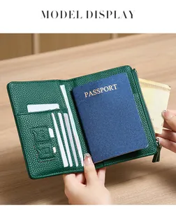 Detail view of dark green lychee leather passport holder with RFID card slots and zipper