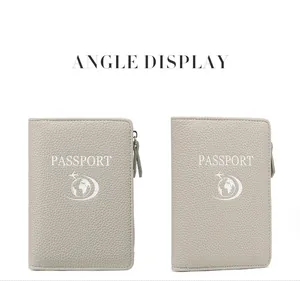 Detail view of grey RFID passport holder with litchi texture and secure zipper closure