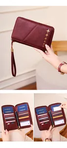 Detail of burgundy RFID passport wallet showing inner card slots and SIM card holder