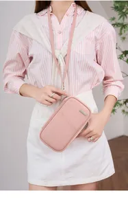 Pink waterproof travel passport pouch with RFID blocking and neck lanyard for security