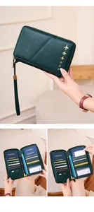 Detail of dark green RFID passport wallet showing multi-card slots and pen holder