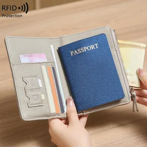 Gray RFID blocking passport holder with pebbled leather texture and multi-card slots