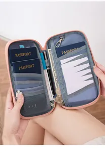Interior view of pink RFID passport bag with card slots and zipper pocket for travel