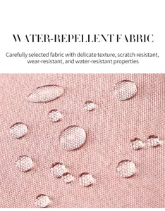 Macro detail of pink water-repellent fabric showing scratch-resistant texture and droplets