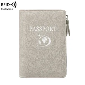 Gray RFID passport holder with litchi grain texture and secure zipper closure