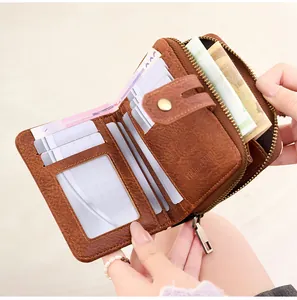 Detail of compact RFID blocking wallet with card slots and metal zipper coin pocket