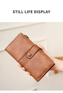 Close-up of vintage brown leather RFID wallet for women with snap closure and zipper