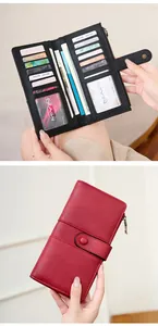 Detail of RFID blocking women's wallet showing internal card slots and red leather exterior